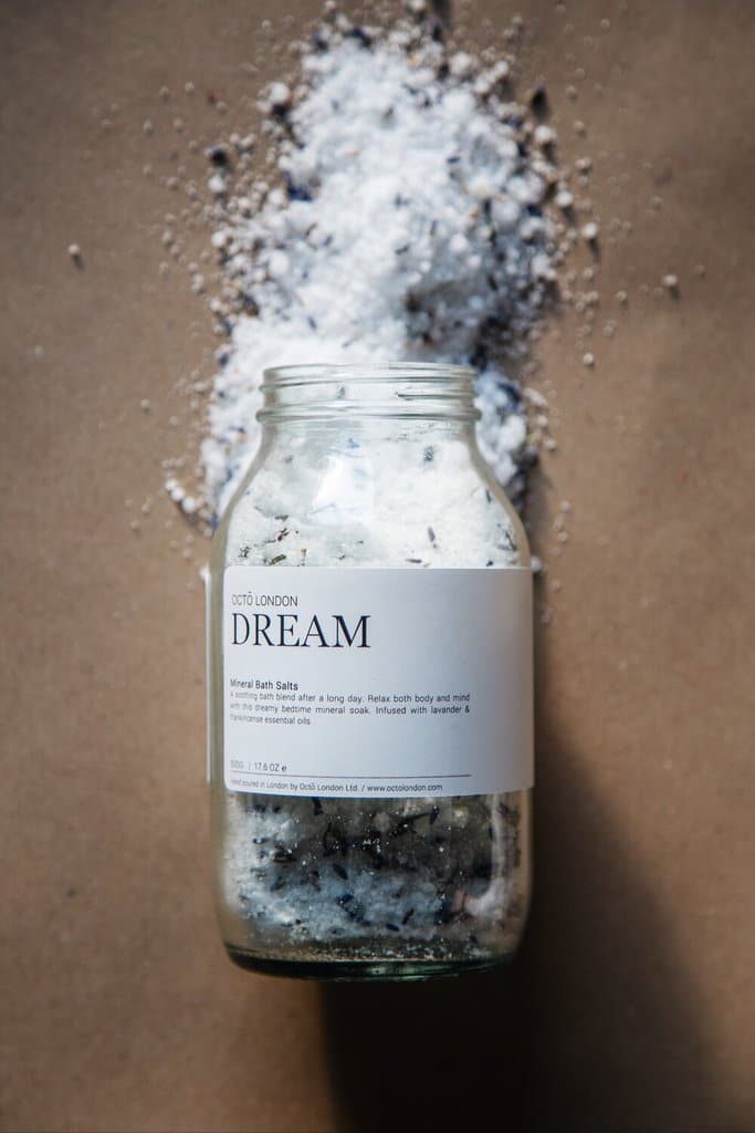 Dream bath salts being poured out a jar.